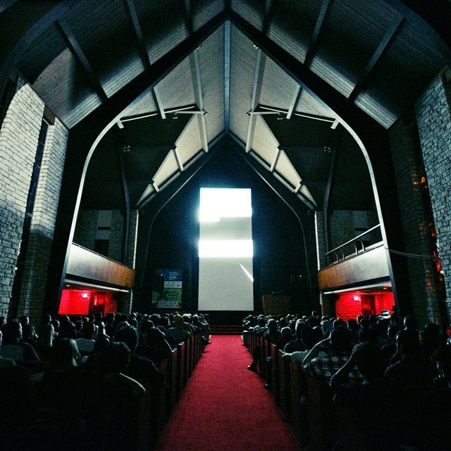 Vertical Video film screening inside of a church like building